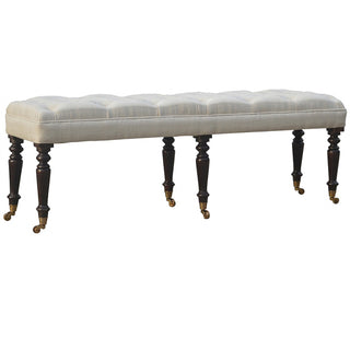 Angled view of Lily Hallway Bench White Cotton Button Tufted Extra-Long Multi Turned Legs Brass Castors