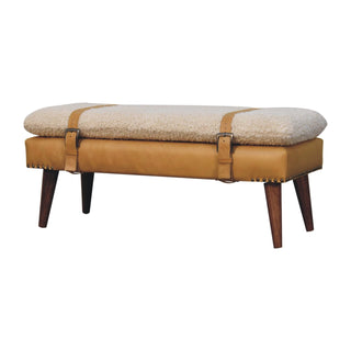 Angled view of Luma Bedroom Bench Cream Bouclé and Tan Leather Belted Strap Dark Tapered Legs