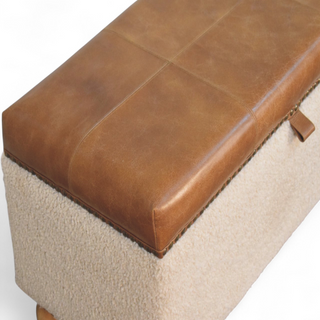 Leg detail view of Mid Century Modern Bouclé Lid-Up Storage Ottoman, showing the upholstered seat, legs and silhouette