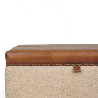 Seat detail view of Mid Century Modern Bouclé Lid-Up Storage Ottoman, showing the upholstered seat, legs and silhouette
