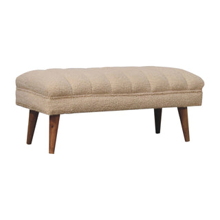 Angled view of Nuvo Living Room Bench Cream Bouclé Channel-Puffed Curved Top Dark Tapered Legs