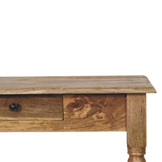Oak-ish writing desk front close-up showing drawer knob and turned leg detail