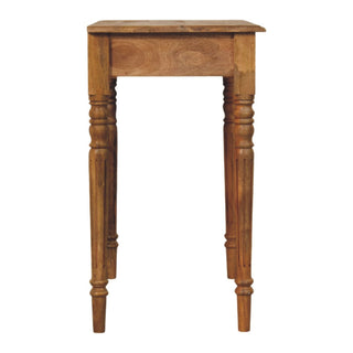 Rear view of oak-ish writing desk showing back panel and solid wood construction