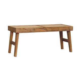 Angled view of Open Rattan Bench, showing the seat, legs and furniture silhouette