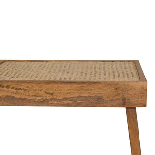 Back view of Open Rattan Bench, showing the seat, legs and furniture silhouette