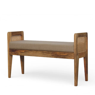 Angled view of Rattan Bench Raised Cane Side Panels Mud Linen Seat Natural Rattan