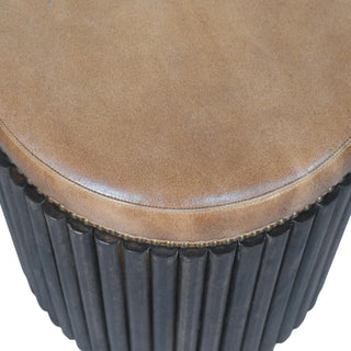 Ribbed leather accent stool top surface showing leather seat and ribbed texture