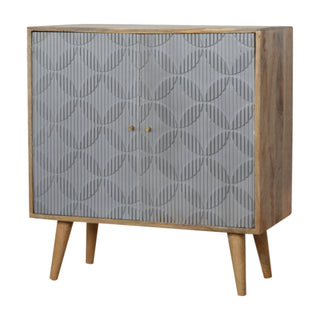 Side angle view of Rivène Small Sideboard Cabinet with Grey Carved Circle Doors and Tapered Legs