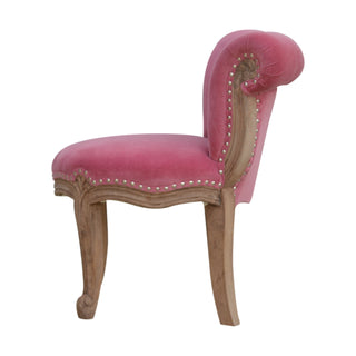 Angled view of Rosette Accent Chair Pink Velvet Studded Scroll Back Cabriole