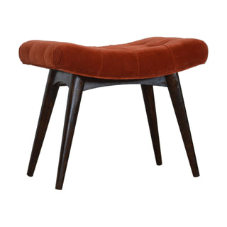 Front view of Rust Upholstered Bench Brick Red Velvet Button Tufted Curved Saddle Near-Black Nordic Legs