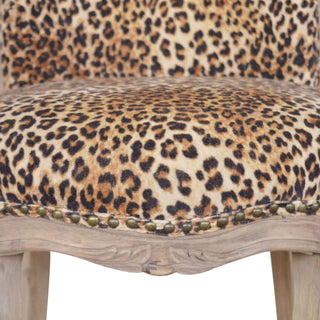 Angled view of Savanna Accent Chair Leopard Print Velvet Studded Scroll Back