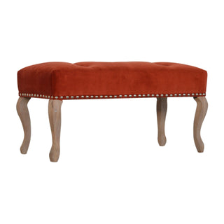 Angled view of Sienna Bedroom Bench Rust Velvet Button Tufted Antique Brass Studs French Cabriole Legs