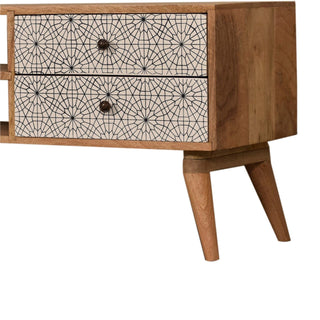 Side angle view of Soleil Media Unit Oak Mango Wood Black and White Mandala Screen-Printed Drawers with Nordic Legs