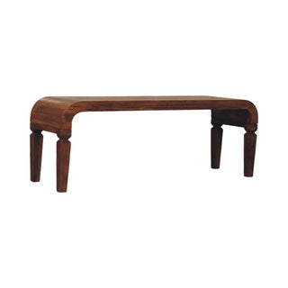 Side angle view of Span Coffee Table Solid Mango Wood Sculpted Arc Edges Amber Oak Tapered Legs