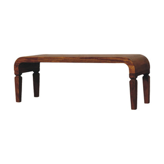 Front view of Span Coffee Table Solid Mango Wood Sculpted Arc Edges Amber Oak Tapered Legs