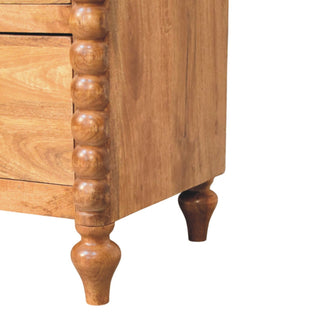 Spindle 3-Drawer Chest - wood grain close-up